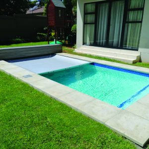designer pool covers A small backyard pool with an Easy Glide Safety Cover.