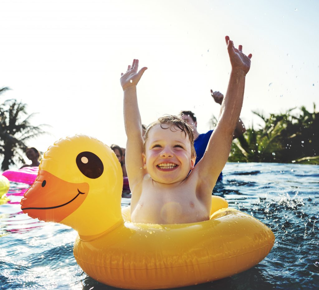 happy boy and a yellow duck tube in the pool 2022 02 02 03 47 44 utc