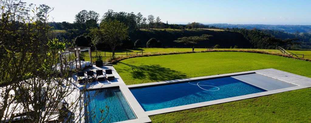 designer pool covers An aerial view of a swimming pool.