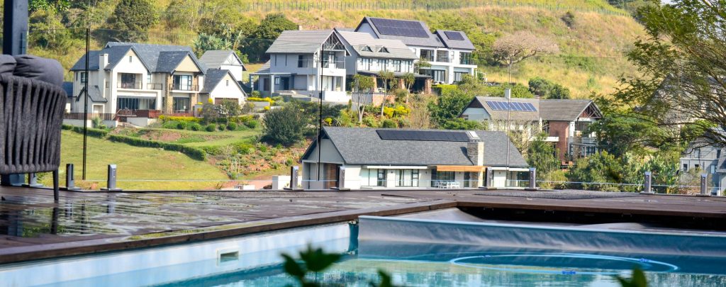 designer pool covers A pool with a hillside view.